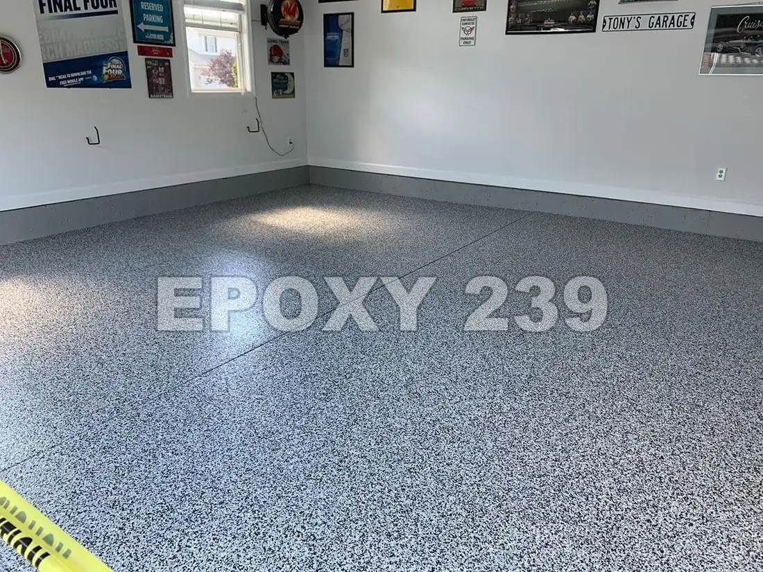 Garage with posters on the wall and a Domino flake epoxy floor